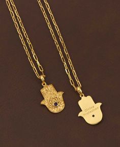 Explore the fusion of spiritual symbolism and artistic design with the 18K gold plated brass necklace, featuring an exquisitely crafted hamsa hand pendant. This ancient symbol, renowned for its protective qualities, is intricately embossed, showcasing a level of craftsmanship that brings depth and texture to the design. Adding to its allure, the pendant is adorned with a small, elegantly studded gemstone, available in three captivating options: the tranquil Amethyst, the mystical Labradorite, an Hamsa Hand Necklace, Buddha Groove, Divine Protection, Spiritual Necklace, Hand Pendant, Hamsa Necklace, Hand Necklace, Brass Necklace, Ancient Symbols