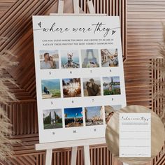 a calendar sitting on top of a wooden easel next to some pamy plants