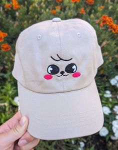 If you love Stray Kids and therefore Skzoo, this was made for you. Perhaps the CUTEST way to rep your bias in a subtle way. This is made from a 100% chino cotton twill brown cap.  If you have more than one bias (which who doesn't), or want to match with someone else, I do have the whole skzoo collection up in my shop! Most members I have as both a cap and a bucket hat, so whatever you need, I have covered.  This product is made especially for you as soon as you place an order, which is why it takes us a bit longer to deliver it to you. Making products on demand instead of in bulk helps reduce overproduction, so thank you for making thoughtful purchasing decisions! Cute Hats With Embroidered Logo And Curved Brim, Cute Baseball Cap With Embroidered Logo, Cute Baseball Cap With Embroidered Logo And Curved Brim, Cute Cream Hat For Gift, Cute Cotton Hat With Curved Bill, Cute Cotton Dad Hat Baseball Cap, Cute Cotton Baseball Cap, Cute Snapback Hat With Curved Brim, Cute Embroidered Adjustable Baseball Cap