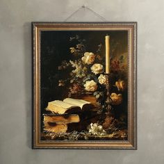 a painting hanging on the wall with books and flowers