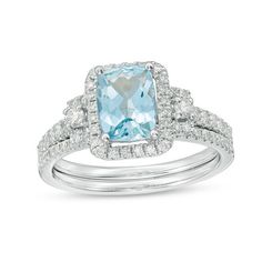 This 1/2 ct. t.w. diamond frame bridal set in 14K white gold features an 8.0 x 6.0mm cushion-cut aquamarine center stone engagement ring. Additional diamonds line the ring's shank and coordinating wedding band. Center Stone Engagement Ring, Diamond Leaf Ring, Black Engagement Ring, Gold Topaz, Diamond Frame, Modern Engagement Rings, Topaz Engagement Ring, Aquamarine Engagement Ring, Black Diamond Ring Engagement