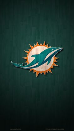 the miami dolphins logo is displayed on a green wall with wood planks behind it