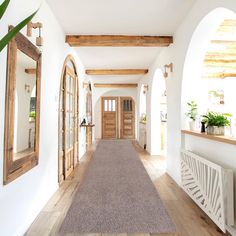 the hallway is clean and ready for us to use as an entrance way in this home