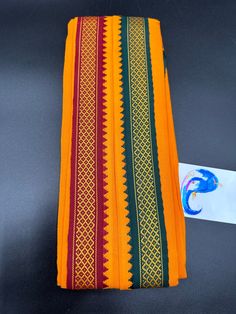 Red & Orange color cotton Angavastram with maroon and green combination borders on both sides This is only Angavastram with out Dhoti/ Pancha Handmade item  Hand loom cotton  size: 1.8 meters  🌸 C A R E . T I P S  🌸 We don't want your special moments to fade. To maintain the quality of your products , please : - Avoid contact with perfumes, other chemicals, including household cleaners. - Do not use chemical jewelry cleaners. - Gently polish with a soft, lint-free cloth after every use. Please do not use a metal polishing cloth. - Store your beloved products in a cool dry place. O U R . P R O M I S E   We believe that customer satisfaction is our utmost priority. So all our products are quality checked, compactly packed and safely shipped so that it reaches you in perfect condition. D I Traditional Wear With Motifs For Puja During Navratri, Traditional Kurta With Traditional Patterns For Navratri, Traditional Kurta For Navratri Rituals, Cotton Kurta With Woven Motifs For Traditional Ceremonies, Red Cotton Traditional Wear, Festival Kurta With Cutdana For Rituals, Ceremonial Cotton Kurta For Navratri, Traditional Red Cotton Dupatta, Orange Cotton Traditional Wear