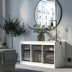 a living room with a large mirror on the wall