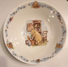 a plate with winnie the pooh on it