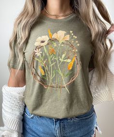 Flower Shirt, Wild Flower Graphic Shirt UNISEX T-Shirt Bella+Canvas 3001 .: 52% cotton, 48% polyester .: Light fabric (4.2 oz/yd²) .: Runs true to size ❤️ Returns & exchanges I don't accept returns, exchanges, or cancellations All sales are final. Thank you for supporting our small business! Patch Tshirt, Mama Cloth, T Shirt Flowers, Botanical Shirt, Butterfly Shirts, Nature Shirts, Gardening Shirts, Floral Tee, Painted Clothes