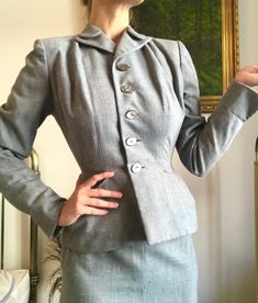 "A gorgeous tailored two piece skirt suit from the 40s. Classic design with a cinched waist, broad shoulders, and padding at the hips for that movie star silhouette. Fully lined. Note the art deco-inspired design of the collar and pockets. The skirt has a kick pleat in the back. In great vintage condition with no noticeable flaws. Jacket measurements (XS) Bust: 35\" Waist: 25\" Shoulders: 15\" Sleeve length: 24\" Length: 23.5\" Skirt measurements (XXS) Waist: 23\" Hips: 27\" Length: 28\"" Vintage Fitted Skirt Suit With Notch Lapel, Retro Fitted Skirt Suit For Tailoring, Vintage Fitted Suits For Office, Vintage Fitted Office Suit, 1940s Suit, Vintage Skirt Suit, Star Silhouette, Pink Babydoll, Womens Suits