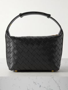 Bottega Veneta's 'Mini Wallace' bag is crafted from leather using its signature intrecciato technique - the iconic weave has defined the brand's accessories since the early '70s. Perfect for days when you don't have much to carry, it's topped with a structured handle and has enough space for your wallet, phone and makeup compact. Luxury Woven Leather Bag With Double Handle, Luxury Double Handle Woven Leather Bag, Woven Leather Top Handle Bag For Office, Leather Handheld Shoulder Bag With Intrecciato Weave, Handheld Leather Shoulder Bag With Intrecciato Weave, Formal Intrecciato Weave Tote Bag, Designer Intrecciato Weave Office Bag, Designer Intrecciato Office Bag, Luxury Bag With Intrecciato Weave For Office