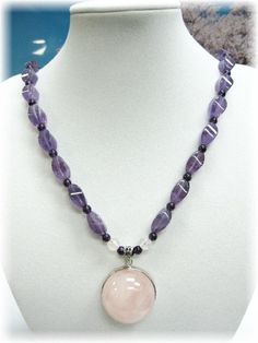 "This is a high grade piece of necklace consisting of 26 pcs of high clarity violet Amethyst which are being spaced in between with round 3mm deep purple Amethyst beads. The high graded Rose Quartz hemisphere shaped pendant is encased in 925 silver rim and bail.  The entire necklace measures 19\" and ends beautifully with a set of 925 silver toggle. This item will come to you in a beautifully packaged box suitable for gift giving. A LITTLE FACT ABOUT AMETHYST: The colours of the amethyst - from Lavender Round Jewelry With Faceted Beads, Amethyst Faceted Beads Jewelry, Round Faceted Amethyst Beads Jewelry, Round Amethyst Jewelry With Faceted Beads, Faceted Amethyst Pendant Crystal Necklace, Spiritual Crystal Necklace With Faceted Beads, Spiritual Single Strand Purple Beaded Necklace, Spiritual Amethyst Round Pendant Necklace, Amethyst Crystal Healing Necklace With Round Pendant