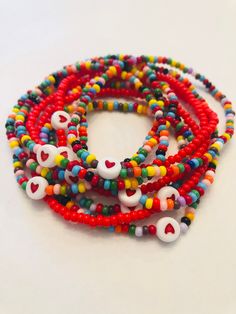 Single Bracelet made of seed beads. Made on stretch cord with cute heart bead in center. Option of Red or Rainbow and Option on size 6 inch or 7 inch. Please reach out if you need a customization. Valentine's Day Adjustable Colorful Beads Friendship Bracelets, Heart Seed Bead, Single Bracelet, Bracelet With Heart, Seed Bead Bracelet, Cute Heart, Seed Bead Bracelets, Colorful Bracelets, Heart Beads