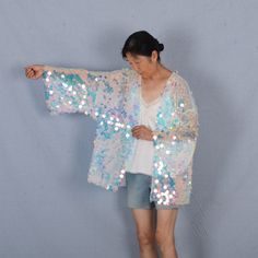 Welcome to my shop, I am in China. It will need around 30 days for international orders. Please consider the time when placing order. Sequin bohemian kimono,perfect for a casual day out. Material: mesh, sequins S size Body width: 27.5 inches(70cm), circle 55 inches(150cm) Shoulder width: 27.5 inches(70cm) Body length:25.5 inches（65cm） Sleeve length:13 inches（33cm） M size Body width: 31.5 inches(80cm), circle 63 inches(160cm) Shoulder width: 31.5 inches(80cm) Body length:25.5 inches（65cm） Sleeve Bohemian Festival Outfit, Sequin Duster, Festival Kimono, Sequin Kimono, Bohemian Kimono, White Mermaid, Rave Clothing, Kimono Duster, Burning Man Festival