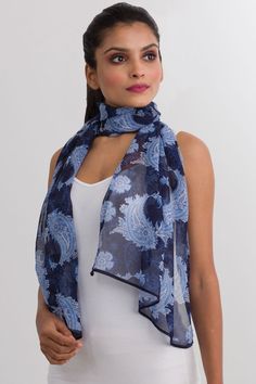 Our Sahila Scarf is made with 100% Cupro material which is a luxurious fabric that is made from the linter fiber of the cotton seed. This fabric has the look and feel of silk, but the lightness, easy care, and breathability of cotton. Featuring a beautiful paisley print, this fair trade scarf is very lightweight, silky, and soft. Dimensions: 20" x 60" Blue Silk Casual Scarves, Blue Silk Casual Scarf, Elegant Blue Paisley Print Scarves, Casual Blue Silk Scarves, Casual Paisley Print Scarves For Summer, Casual Summer Scarves With Paisley Print, Casual Summer Paisley Print Scarves, Caftan Tunic, Paisley Scarf