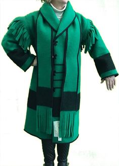 "AuSable® Brand Full Wool Capote Coat Green Color 19th century trappers, hunters and frontiersmen across North America wore timeless garments like this to battle cold weather. The AuSable® Brand Hudson Bay Capote Coat, full-length design is rugged, stylish cold-weather clothing made from naturally warm wool blankets. NO MORE GOOSEBUMPS! The Capote (French for \"cape\") was commonly crafted from naturally warm wool blankets. These Coats were the epitome of simplicity... hailed by woodsmen, trappers and the like in early North America and Canada. It's seriously ideal cold-weather survival attire, as seen in Canada and the Yukon." Capote Coat, Hudson Bay Blanket, Wool Blankets, Blanket Coat, Santa Suits, Hudson Bay, Coat Patterns, Cold Weather Outfits, Green Coat