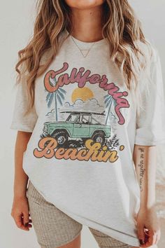 CALIFORNIA BEACHIN' GRAPHIC T-SHIRT- Premium 4.2 oz., 100% airlume combed and ring spun cotton- Retail fit- Unisex sizing- Shoulder taping- Side seamed- Pre-shrunk* SUMMER, SUMMER TEE, SUMMER GRAPHIC, SUMMER OUTFIT, BEACH, OCEAN, SAND, SUN, SWIM, VACATION, TRAVEL, OUTDOOR, CAMPING Style: CASUAL Print / Pattern: CALIFORNIA BEACHIN Silhouette: TEE Fit: UNISEX Neck Line: CREW Sleeve: SHORT Fabric Contents: 100% COTTON Stretch fabric Non-sheer fabric Care Instructions: Machine wash warm, inside out, Beach Tee Shirt Designs, Sun Graphic Tee, Beach Cotton T-shirt With Front Print, Summer Cotton T-shirt For Surfing, Relaxed Fit Pre-shrunk Tops For Summer Adventures, Trendy Cotton T-shirt For Surfing, Summer T-shirt With Sublimation Print And Relaxed Fit, Trendy Tri-blend Tops For Summer, Soft-washed White T-shirt For Beach