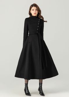 FEATURES 50% wool, 50% wool blend Fully liner with polyester Two pockets Stand up neckline Long sleeve Button closure in front Tie belt waist For Winter, Autumn Long wool coat Black wool coat dry clean ★★Mode size Height 170cm (5′ 7″)  Bust 84 cm (33")  Waist 66 cm (26")  She wears size XS. ★★Bespoke Order Service If you Request other color Request the length Your height is not between 155 cm- 175 cm Your weight is not between 47 kg -77 kg I can do it for you, It will need some extra fee depending on on your need. Contact with me for more detail. ★★ Warmly Note: 1 ) : Please confirm your shipping address! If you wish to ship the item to a different address, please send me a message immediately after purchase. We can't change it after shipping, thank you for your understanding. 2 ) : Due to Formal A-line Wool Coat For Fall, Fitted Belted Wool Coat For Winter, Chic A-line Wool Outerwear, Chic A-line Wool Coat For Work, Chic Stand Collar Wool Coat For Winter, Chic Wool Coat With Stand Collar For Winter, A-line Outerwear For Winter Workwear, A-line Winter Workwear Outerwear, A-line Winter Outerwear For Work