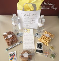 a table topped with water bottles and snacks