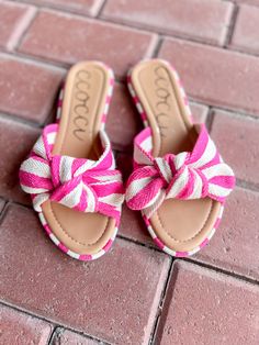 Introducing RACHAEL—a playful dance of style and comfort. These sandals showcase a delightful striped cotton canvas adorned with a charming bow, adding a touch of whimsy to your look. STYLE DETAILS: STRIPED COTTON CANVAS BOW SANDAL SLIP-ON FLAT SLIDE Trendy Beach Sandals With Bow, Spring Open Toe Sandals For Picnic, Casual Sandals For Spring Picnic, Casual Spring Picnic Sandals, Summer Bow Sandals For Beach, Adjustable Bow Sandals For Beach, Pink Sandals For Spring Day Out, Summer Round Toe Sandals For Picnic, Casual Pink Sandals With Bow