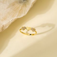 14K Solid Gold Stackable Minimalist Three Heart Ring with Cubic Zircon - Dainty Triple Hearth Band Ring for Anniversary Gift - Christmas Gift * PRODUCT FEATURES * ✔️Band Width: 1.70 mm ✔️Top Width: 4.54 mm x 16.57 mm ✔️Thickness: 1.30 mm ✔️Gemstone: AAA Grade White Cubic Zirconia Crafted from 14K solid gold, this stackable minimalist ring features three delicately designed hearts adorned with cubic zirconia. The dainty triple heart band creates an elegant and timeless piece, making it a perfect Gold Crystal Promise Ring For Valentine's Day, Gold Heart-shaped Promise Crystal Ring, Heart-shaped Gold Crystal Promise Ring, Gold Heart-shaped Crystal Promise Ring, Triple Heart, Heart Band, Fine Jewelery, Minimalist Ring, Gift Product