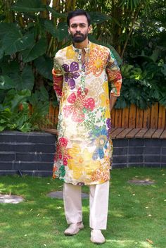 *PRODUCT DETAILS:- Offering a fresh and lively look, this off white kurta set features a vibrant orange rani purple blue and yellow floral print. The digital print all over floral design enhance its elegance. Ideal for daytime events ,sangeet or summer gatherings, style this kurta set with matching white jutis and a simple watch or bracelet to complete the ensemble. *FEATURES:- Color: Off-white digital print Fabric: 100% Polyester French Crape Design Type: Digital Print kurta floral design all over Items Included:  (i)  Kurta ,  (100% polyester) (inner layer of 100% cotton)                               (ii) Pant Elastic (100% heavy tensile dyed) Neckline: Stand Collar Sleeve Type: Full Sleeves Wash Care: Dry Clean Only Disclaimer Text: Product color may slightly vary due to photographic l Multicolor Long Sleeve Cotton Lawn Suit, Casual Multicolor Lawn Suit With Printed Motifs, Casual Multicolor Printed Lawn Suit, Casual Yellow Lawn Suit For Spring, Casual Yellow Sets For Eid, Multicolor Straight Kurta Sets For Summer, Yellow Cotton Lawn Suit For Summer, Casual Multicolor Lawn Suit For Spring, Summer Yellow Cotton Lawn Suit