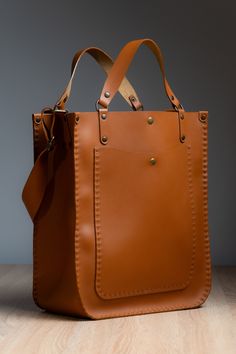 Our handcrafted bag is made from premium Italian leather in a warm ginger color - with a big love and passion! ❤️ ⚒ It features a magnet and adjustable strap, combining style and practicality.  ✔️The design allows it to be worn both on the shoulder and carried by hand, offering versatile carrying options for any occasion. Each bag from our store - is unique, making it a one-of-a-kind accessory. ⚒ About the Bag: *Size: 36x30x15 cm *Color: Ginger *Material: Italian Leather *Lock Type: Magnet World Leather Bag Aesthetic, Big Hand Bag, Unique Leather Bag, Ginger Color, Woman Bag, Favorite Handbags, Handcrafted Bags, Cute Handbags, Leather Box