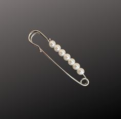 Decorative pearl pin for Brides Wedding bouquet. Photo charms seen in some photos are NOT included in this listing Your choice of 2 color: Gold Dark Silver ( Antique Silver) ( approximately 2 1/2 inches ) All product is lead and nickel free Wedding Brooch In Safety Pin Shape, Elegant Safety Pin Brooch, Elegant Safety Pin Shaped Brooches For Gifts, Elegant Safety Pin Brooches As Gifts, Elegant Safety Pin Brooches For Gifts, Classic Silver Wedding Pins, Elegant Silver Pins For Jewelry Making, Bouquet Photo, Wedding Bouquets Bride