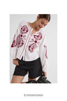 Flowing blouse featuring a round neck, long sleeves with elasticated trim, contrast embroidery and a button-up front. Available in assorted colours. Casual Long Sleeve Embroidered Blouse, Folk Style Long Sleeve Top With Embroidered Cuffs, Long Sleeve Cotton Embroidered Top With Cuffs, Cotton Embroidered Cuff Long Sleeve Top, Casual Long Sleeve Top With Contrast Embroidery, Cotton Embroidered Long Sleeve Top, White Long Sleeve Blouse With Embroidered Hem, Spring Long Sleeve Top With Embroidered Cuffs, Spring Long Sleeve Embroidered Top