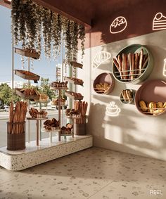 a display case filled with lots of pastries in front of a storefront window