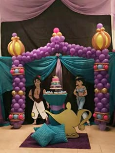 the little mermaid birthday party is decorated with purple and gold balloons, blue drapes, and a teapot