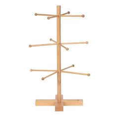 a wooden tree with several branches on it's sides and four pegs in the middle