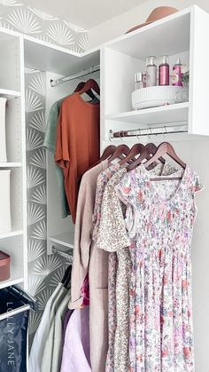 an organized closet with clothes and other items