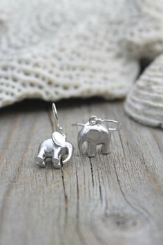 Adorable Pair of lucky elephant earrings on 925 sterling silver French ear wires. Perfect for a little girl or anyone whos looking for extra good Tiny Huggie Sterling Silver Earrings, Cute Sterling Silver Dangle Earrings, Cute Sterling Silver Earrings With Ear Wire, Handmade Playful Sterling Silver Jewelry, Playful Handmade Silver Jewelry, Tiny Silver Huggie Earrings, Cute Sterling Silver Drop Earrings, Playful Sterling Silver Hypoallergenic Jewelry, Tiny Cute Sterling Silver Earrings