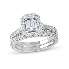 Display your love for all to see with the stunning design of this platinum emerald-cut diamond scallop frame bridal set. Fashioned in sleek platinum The 3/4 ct. emerald-cut center diamond sparkles in a scalloped diamond-lined frame. Additional diamonds shimmer along the shank. The coordinating diamond-lined wedding band completes the ensemble. This bridal set shines with 1-3/4 cts. t.w. of diamonds. Center Stone Engagement Ring, Diamond Frame, Peoples Jewellers, Stone Engagement Rings, Platinum Metal, Emerald Stone, Emerald Cut Diamonds, Bridal Set, Bridal Sets