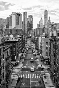 black and white photograph of an empty street in the middle of new york's financial district