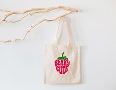 a tote bag hanging on the wall with an apple printed on it that says geeks cut