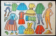 an old fashion paper doll with clothes and accessories