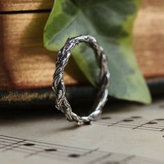 Meet the latest addition to our enchanting Silvestre stacking collection. It is meticulously designed to seamlessly blend with your current Dixi stack or stand out as a statement ring on its own. With its tightly bound Hawthorne branches, this latest addition brings a touch of nature with a gothic twist to your stacking ring collection. MaterialSterling Silver SizingHeight - 2mm Modern Twist Ring Jewelry Gift, Modern Twist Ring Jewelry As Gift, Adjustable Jewelry With Ring Detail For Gift, Adjustable Jewelry With Ring Detail As A Gift, Modern Stackable Jewelry As Gift, Modern Jewelry With Ring Detail As A Gift, Modern Twist Jewelry With Ring Detail Gift, Modern Twist Jewelry With Ring Detail As Gift, Modern Twist Adjustable Midi Rings As Gift