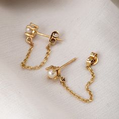 14K 18K Solid Gold Thread Chain Pearl Earrings, White Pearl Earrings With Dangling Chain, Stylish Everyday Jewelry, Great Gift For Her Material: Solid Gold Karat: 14 K (585), 18K (750) M o r e * F r o m * U s Goldstore Jewelry - https://etsy.me/3gHtcrZ * Editor's Pick - https://etsy.me/3CCLlmm * Cremation Urn Jewelry - https://etsy.me/3MM0Lcq * Stud Eearrings - https://etsy.me/3t4ZhlR * Diamond Earring - https://etsy.me/3i2NzCc * Birthstone Earring - https://etsy.me/3tYzWcO * Evil Eye Earring - Gold Sterling Silver Pearl Chain Earrings, Yellow Gold-plated Earrings With Adjustable Chain, Yellow Gold Plated Earrings With Adjustable Chain, Dainty Tarnish Resistant Pearl Earrings For Anniversary, Dainty Tarnish-resistant Pearl Earrings For Anniversary, Gold Pearl Chain Earrings In 14k Gold, Gold Plated Cable Chain Jewelry For Wedding, Gold-plated Cable Chain Jewelry For Wedding, 14k Yellow Gold Earrings With Pearl Chain