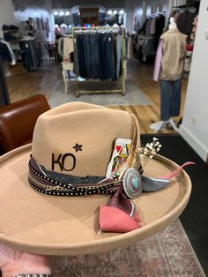 Can't make it to a Hat Bar pop-up or into our store to build a custom hat at our Hat Bar? No problem! Join us for a 1 hour session to create the hat you've been dreaming of. If you'd like to mail me items you'd like included in your custom hat build please mail them to me at 141 S Main Street, Stoddard, WI 54658 at least a week prior to your virtual session. You are responsible for shipping items and your finished hat to you. Included: 1 hour with stylist over FaceTime, all materials and brandin Embellished Cowgirl Hat, Make Your Own Cowgirl Hat, Western Hat Bar, Custom Hat Ideas For Women, Custom Brim Hats, Hat Bar Display, Hat Bar Accessories, How To Make A Hat Band, Painted Cowboy Hats Diy