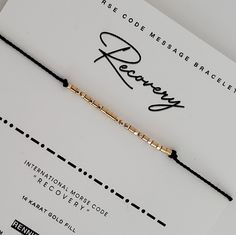 What better way to let someone special know how proud you are of their  "RECOVERY"  than in a secret Morse code message bracelet they can keep close to them on their wrist.   🖤 Dainty and subtle, "RECOVERY"  is spelled out in Morse code alphabet using  high quality .925 Sterling silver, 14 karat gold fill, rose gold, and 14 karat solid gold beads. 🖤 Band is made from Durable, High Quality 100% Silk Cord in your choice of color. 🖤 End beads and closure bead are coordinating sterling silver or Morse Alphabet, Morse Code Alphabet, Code Alphabet, Secret Message Bracelet, Coded Message, Message Bracelet, Hidden Message, Morse Code Bracelet, Morse Code