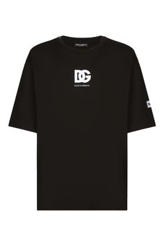 This classic black t-shirt from Dolce & Gabbana showcases a prominent logo print on the front along with a logo patch on the sleeve. The design emphasizes comfort with its regular fit and short sleeves, making it perfect for casual outings or streetwear styles.

- Composition: 100% Cotton  
- Regular fit design Streetwear Styles, Designer Products, Printed T Shirts, Print Logo, Logo T Shirt, Black T Shirt, Black Print, Luxury Outfits, The List