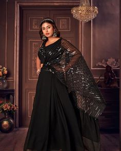 Trendy indowestern  crop top lehanga set.  This unique dress comes with attached style drape in metallic and satin material.  Fabric: Georgette and imported satin Color : black  Size :40 Party Pre-draped Saree With Mirror Work In Art Silk, Pre-draped Saree With Dupatta For Navratri Party, Semi-stitched Party Sets For Diwali, Festive Pre-draped Saree For Party Season, Bollywood Georgette Pre-draped Saree For Party, Party Floor-length Art Silk Pre-draped Saree, Festive Pre-draped Maxi Length Georgette Saree, Evening Pre-draped Saree With Mirror Work For Eid, Glamorous Evening Sharara With Dupatta