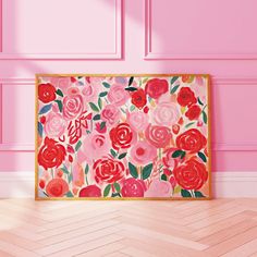 a pink wall with red and pink flowers on it in front of a wooden floor