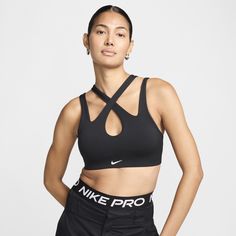 Whether you cross the straps of this bra on the front or the back, it's ready to freestyle. Light support gives you a gentle hold with plenty of freedom while sweat-wicking tech and soft, smooth fabric help keep you comfortable through all your moves. Nike Sporty Sports Bra For Pilates, Sporty Strappy Sports Bra, Nike Functional Sports Bra For Pilates, Versatile Nike Activewear For Sports, Strappy Sports Bra With Built-in Padding, Fitted Black Sports Bra With Crisscross Straps, Black Strappy Sports Bra With Crisscross Straps, Black Activewear With 4-way Stretch And Cross Back, Black Sports Bra With Crisscross Straps For Yoga