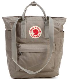 From Fjallraven&#x2C; the Kanken Convertible Totepack Backpack features: Vinylon F: 100% vinylal A tote version of Fjällräven’s iconic backpack from 1978Can be carried on the shoulder or as a backpackMade from hardwearing&#x2C; water-resistant Vinylon F fabricTop-loaded zippered main compartmentInside 13" laptop/tablet sleeve with padded baseIncludes a seat pad stored in an inside pocket in the back of main compartmentWebbing shoulder strap Fjallraven Kanken Backpack Rei, Fjallraven Kanken Inside Backpack, Cheap Casual Backpack For Trips, Fjallraven Kanken Kawaii, Cheap Everyday Navy Backpack, Kanken Mini Whats In My Bag, Fjallraven Kanken Backpack Cheap, Cheap Vans Travel Backpack, Fjall Raven Kanken Backpack Pink