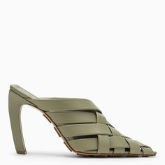 Travertine-coloured, Intrecciato-patterned mule by Bottega Veneta with a pointed design, curved heel and leather sole with embossed grommets. Bottega Veneta Stretch Sandals, Bottega Veneta Mules, Travertine Colors, Black Mule, Beige Sandals, Rubber Sandals, Black Leather Sandals, Mule Sandals, Blue Sandals