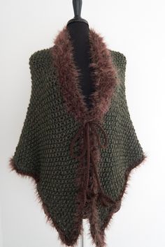 "Cozy up in this earth color shawl while watching your favorite TV series or reading Diana Gabaldon's book. I made this shawl from soft wool/acrylic yarn. It is embellished with faux fur trim and cords that can be tied. AVAILABLE: Size Large US Measurements: Tip to tip: approx.69\" (175cm) Top to bottom: approx.35\" (89cm) See more shawls here - https://www.etsy.com/shop/KnitsomeStudio/items?section_id=25373486 and here - https://www.etsy.com/shop/KnitsomeStudio?section_id=6598836 Don't forget t Winter Shawl Knitting Pattern, Cozy Knitted Shawl, One Size, Cozy Knitted Shawl One Size, Cozy Knitted One-size Shawl, Winter Knit Shawl Wrap, Winter Knitted Shawl Pattern, Knitted Shawl For Fall, Brown Crochet Shawl For Fall, Winter Shawl Knitting Pattern One Size