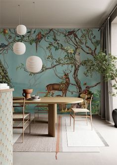 the dining room is decorated with wallpaper and chairs, along with an animal mural on the wall