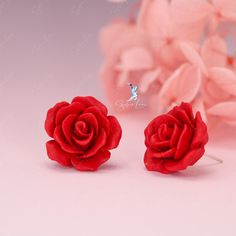 These elegant resin rose flower stud earrings feature a beautiful rose design in white or red color, complete with a sterling silver needle and back. Perfect for weddings and as a luxurious gift, these earrings can also elevate any outfit for daily wear. Enhance any outfit and feel truly elegant with these stunning resin rose flower stud earrings! Available in both white and red, their captivating rose design and high-quality sterling silver needle and back make them a luxurious addition to your daily wardrobe. Perfect for weddings or as a thoughtful gift, these earrings will surely make a statement and leave a lasting impression. Add a touch of beauty and sophistication to your style with these exquisite studs. Materials: 925 sterling silver, resinDiameter: 0.79 in Jewelry Care: See more Elegant Rose Red Flower-shaped Earrings, Rose Red Rose Design Flower Earrings For Wedding, Formal Rose Earrings With Rose Design, Rose Red Flower Design Earrings For Wedding, Elegant Rose Red Earrings For Valentine's Day, Elegant Rose Red Jewelry With Rose Design, Formal Rose-design Rose Earrings, Flower Shaped Rose Earrings For Gift, Rose Flower Earrings For Gift