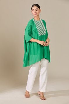 Green gathered top with metallic pearl embroidered front yoke. Comes with inner slip. - Aza Fashions Green Blouse With Embroidered Neckline, Festive Tunic Top With Embroidered Neckline, Festive Green Tunic Top, Elegant Festive Top With Yoke Detail, Festive Yoke Top, Spring Festive Tunic Top, Gathered Top, Green Embroidery, Green Blouse